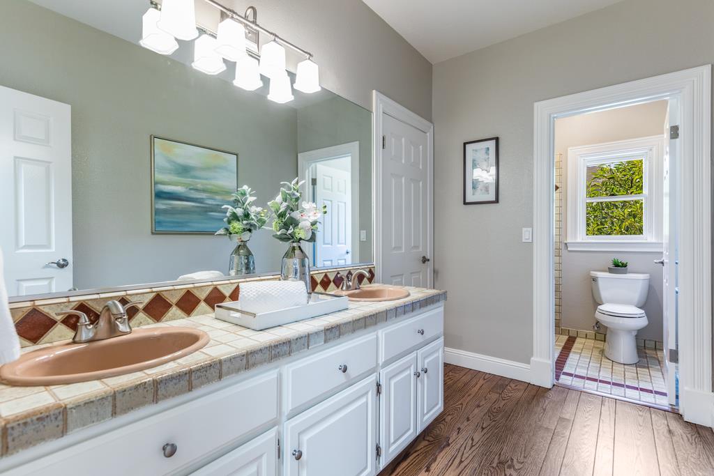 12385 Parker Ranch Road Saratoga, CA 95070 - Photo 41 of 50 a bathroom with a sink and a mirror