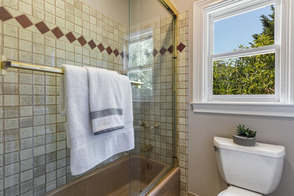 12385 Parker Ranch Road Saratoga, CA 95070 - Photo 42 of 50 a bathroom with a bathtub and shower