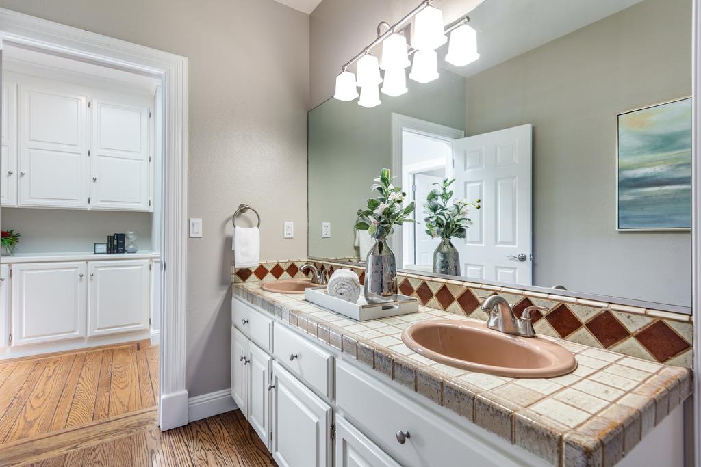 12385 Parker Ranch Road Saratoga, CA 95070 - Photo 43 of 50 a bathroom with a sink and a mirror
