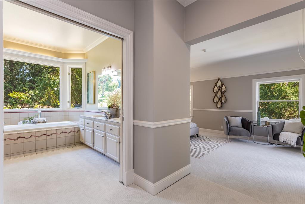 12385 Parker Ranch Road Saratoga, CA 95070 - Photo 44 of 50 a large white room with a large window and a couch