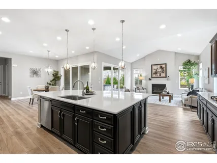 a kitchen with a dining table and chairs