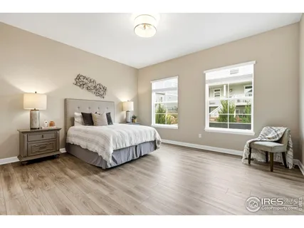 a bedroom with a bed and a table