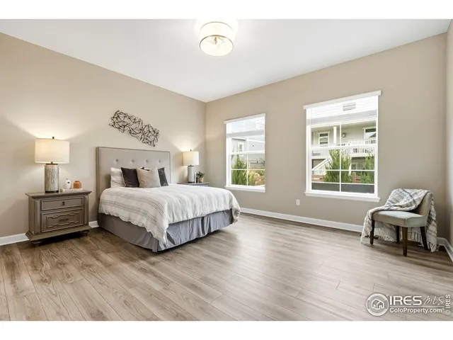 a bedroom with a bed and a table