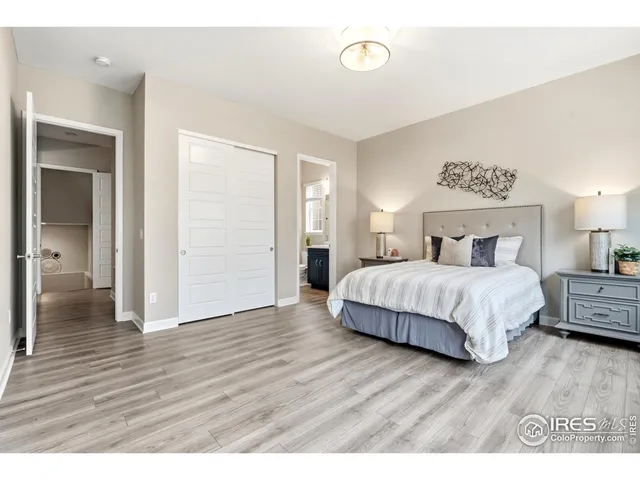 a bathroom with a sink toilet vanity and shower