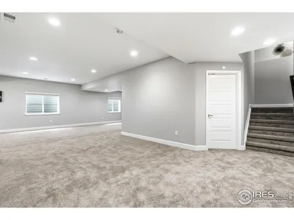 a kitchen with a sink cabinets and window