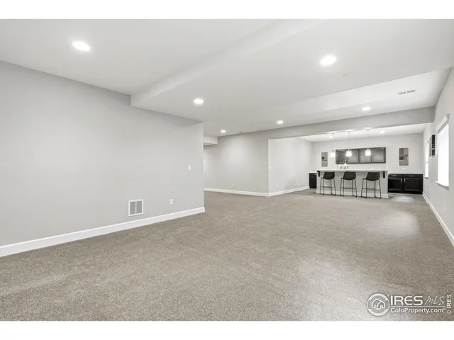 a kitchen with a sink a counter space appliances and cabinets