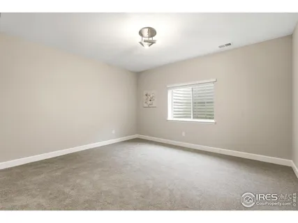 a bathroom with a sink a toilet a large mirror and shower