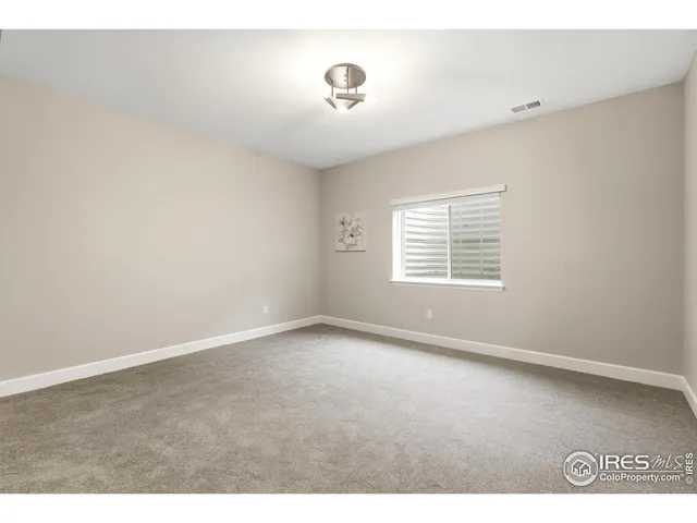 a bathroom with a sink a toilet a large mirror and shower