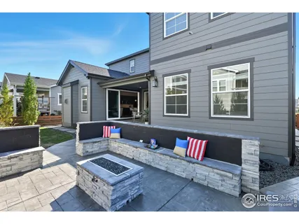 an aerial view of a house with a swimming pool yard and outdoor seating