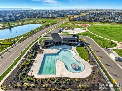 a view of a swimming pool and a yard