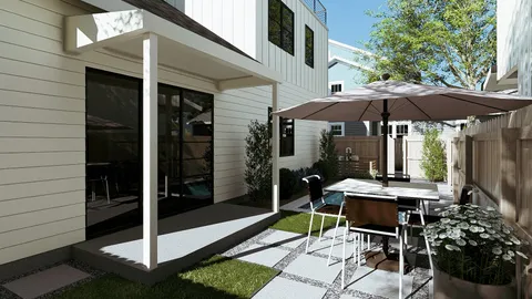 a patio with a table and chairs under an umbrella