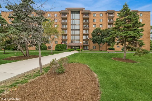 a view of a building with a yard