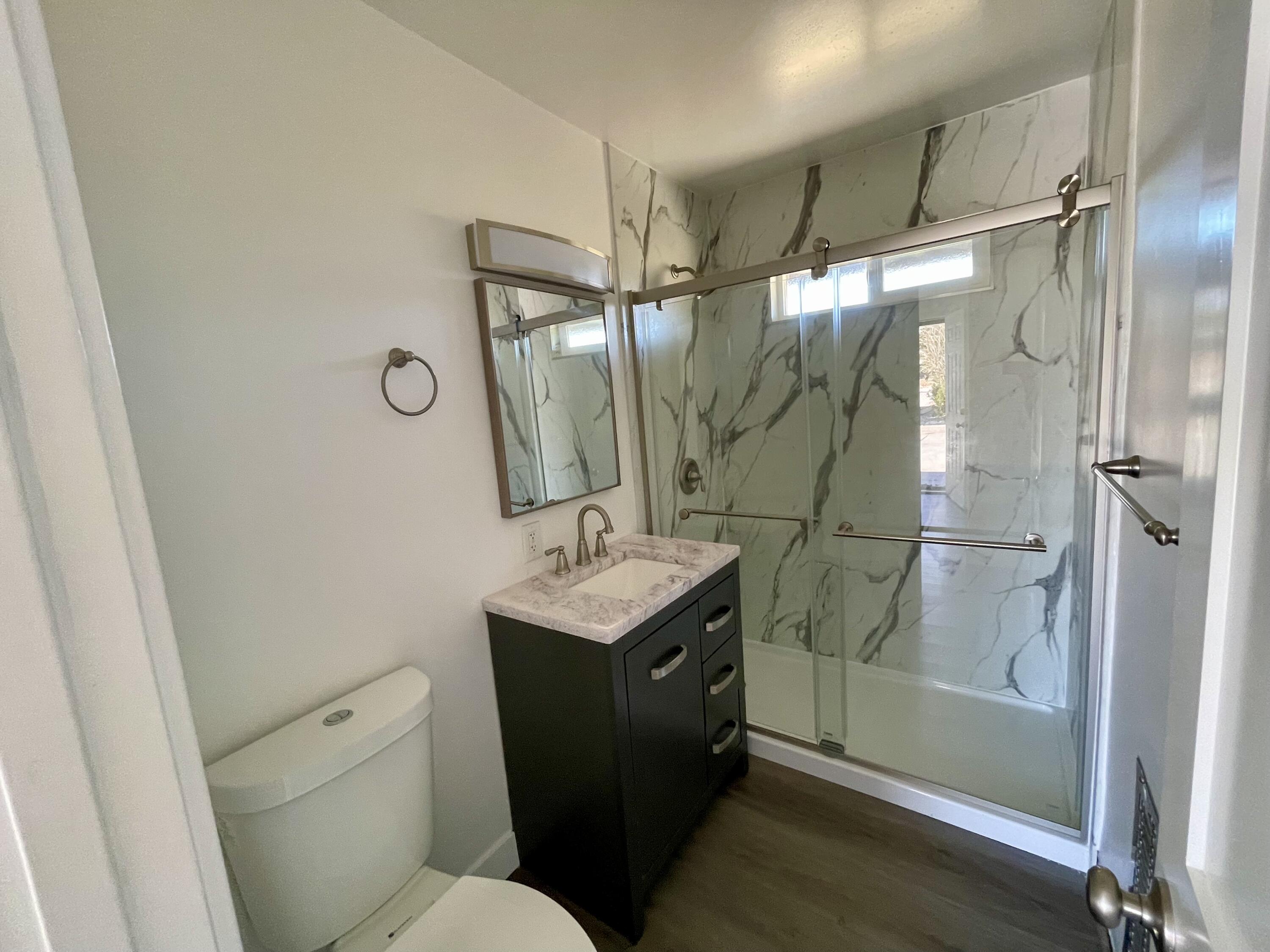61880 Verbena Road Joshua Tree, CA 92252 - Photo 11 of 20 a bathroom with a granite countertop sink toilet and shower