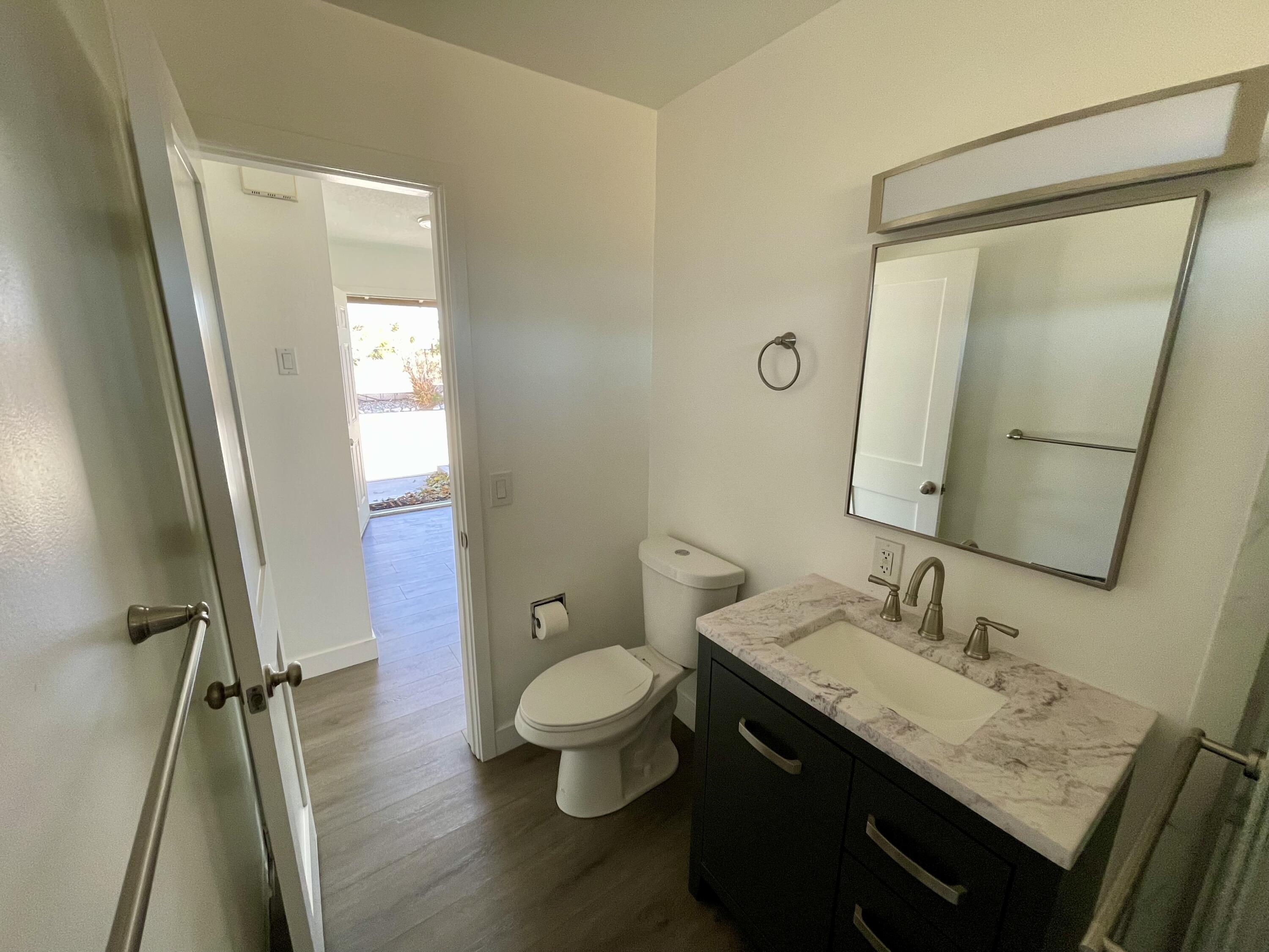 61880 Verbena Road Joshua Tree, CA 92252 - Photo 12 of 20 a bathroom with a granite countertop sink toilet and shower