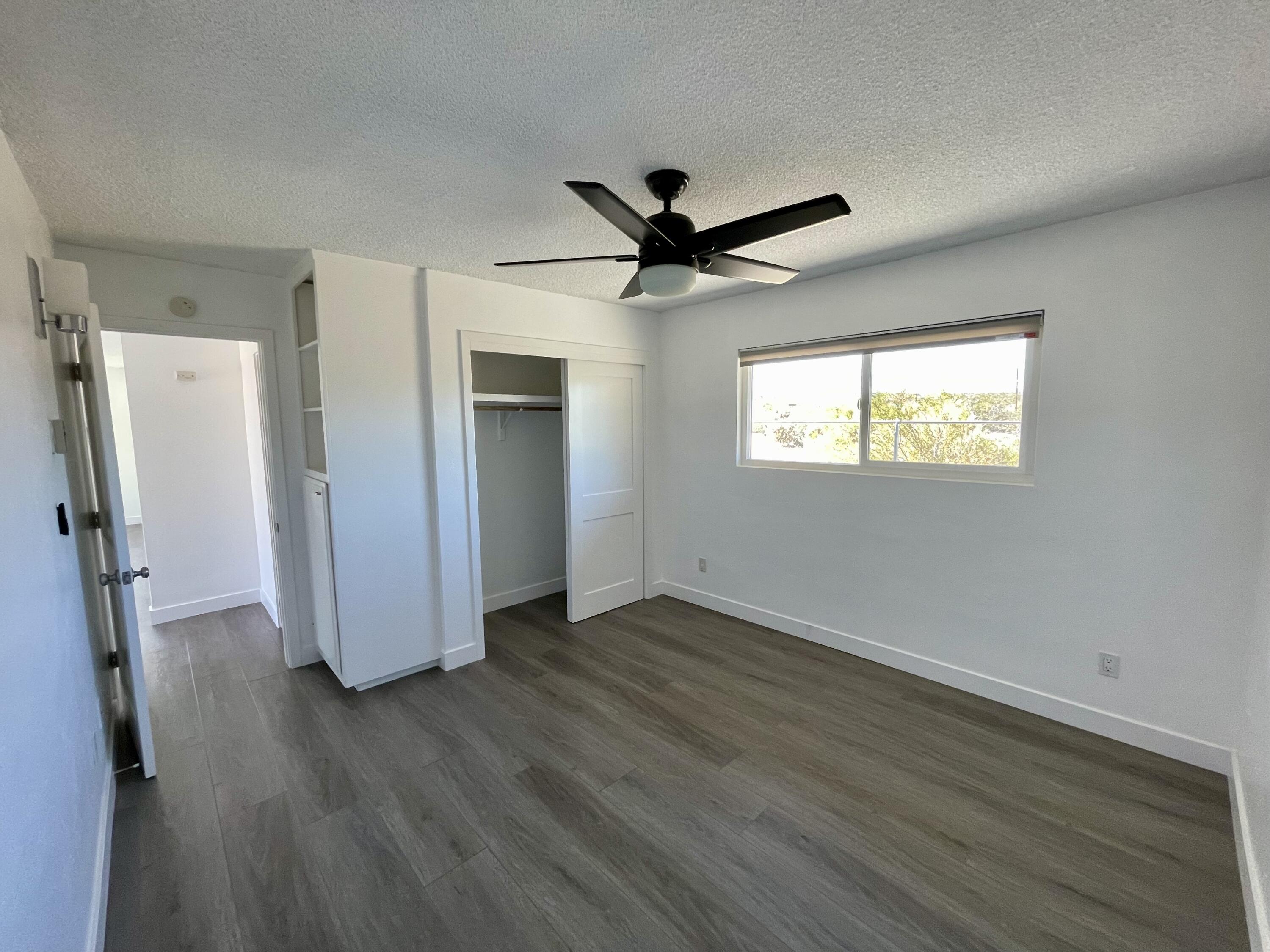 61880 Verbena Road Joshua Tree, CA 92252 - Photo 13 of 20 wooden floor in an empty room with a window