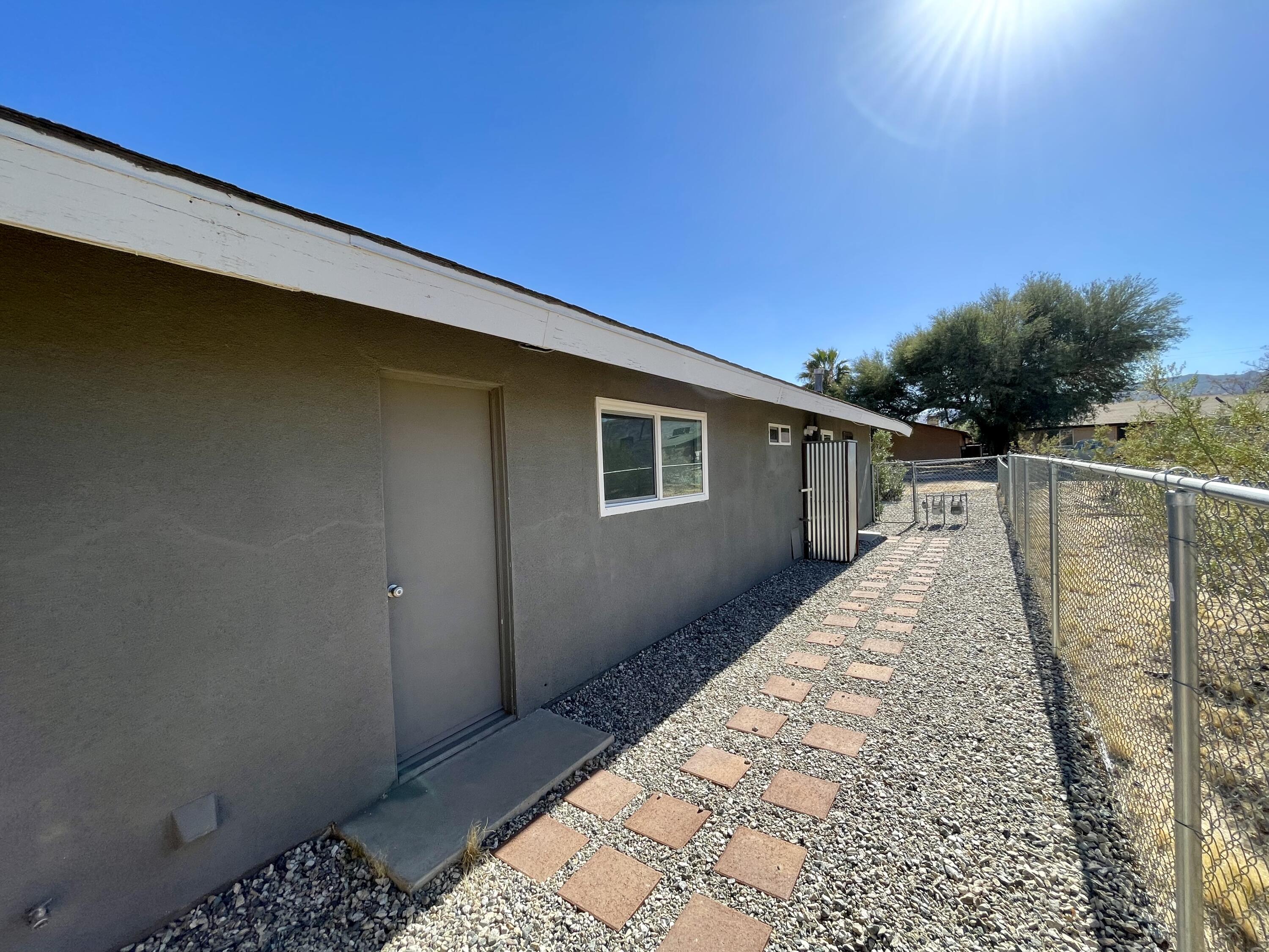 61880 Verbena Road Joshua Tree, CA 92252 - Photo 18 of 20 a house view with a backyard