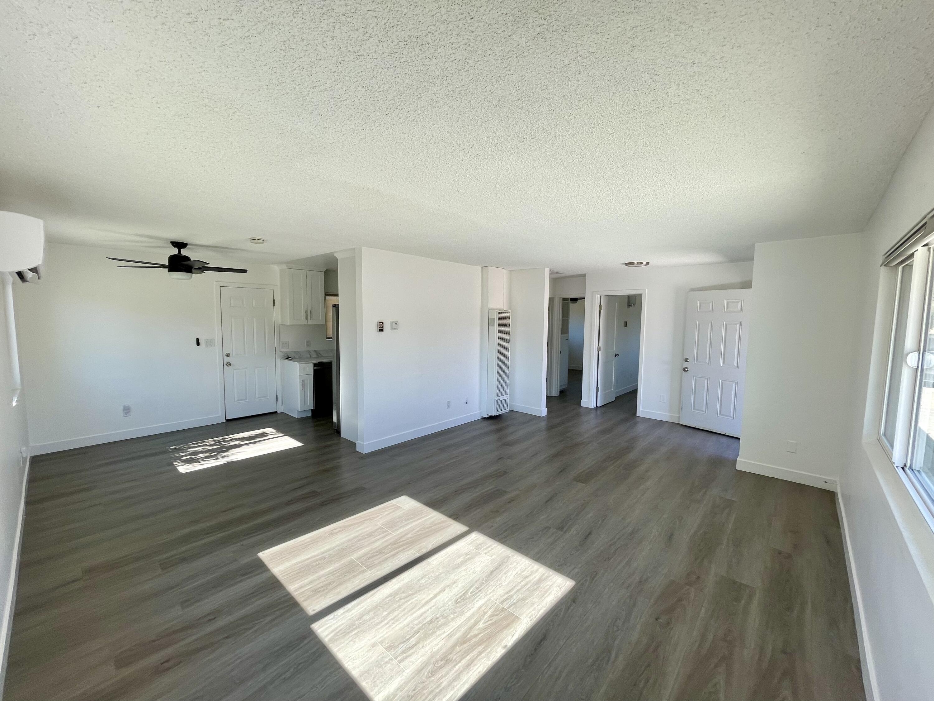 61880 Verbena Road Joshua Tree, CA 92252 - Photo 5 of 20 wooden floor in an empty room with a window