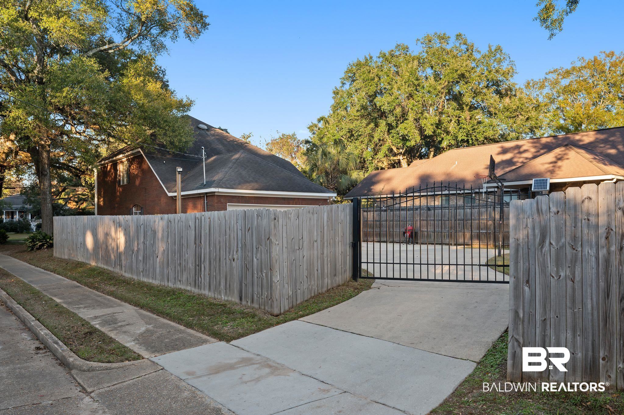 1825 Spring Hill Avenue Mobile, AL 36607 - Photo 41 of 43 Gate with a fenced front yard