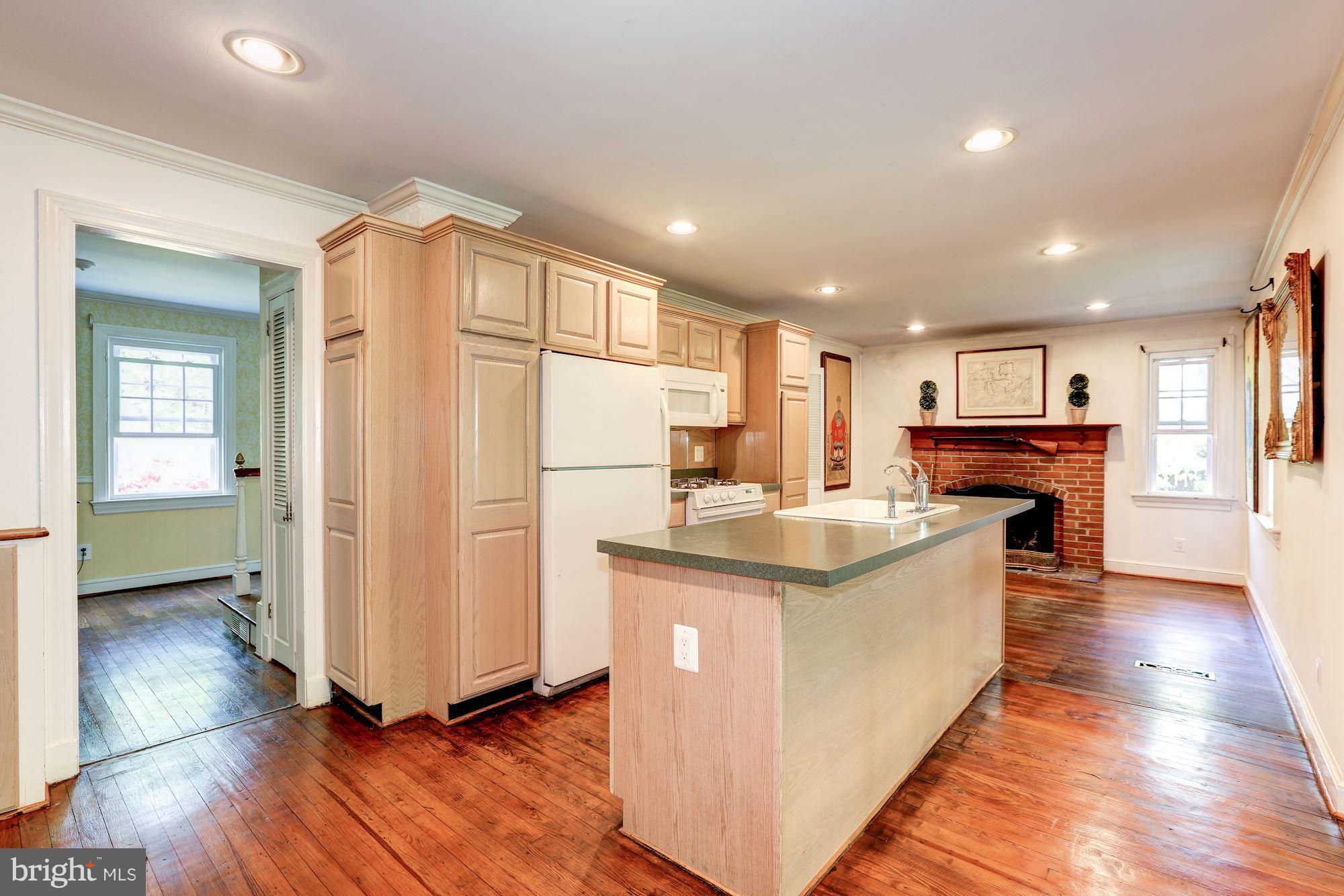 11511 Glen Road Potomac, MD 20854 - Photo 6 of 28 Large open eat-in kitchen with fireplace
