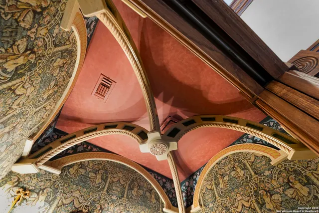 a living room with fireplace furniture and a large window