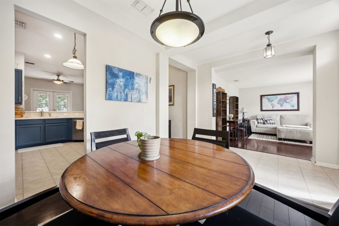 86132 Red Holly Place Yulee, FL 32097 - Photo 14 of 40 a dining room with table chairs and kitchen view