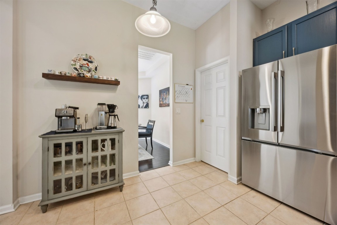 86132 Red Holly Place Yulee, FL 32097 - Photo 18 of 40 a kitchen with stainless steel appliances a refrigerator and cabinets