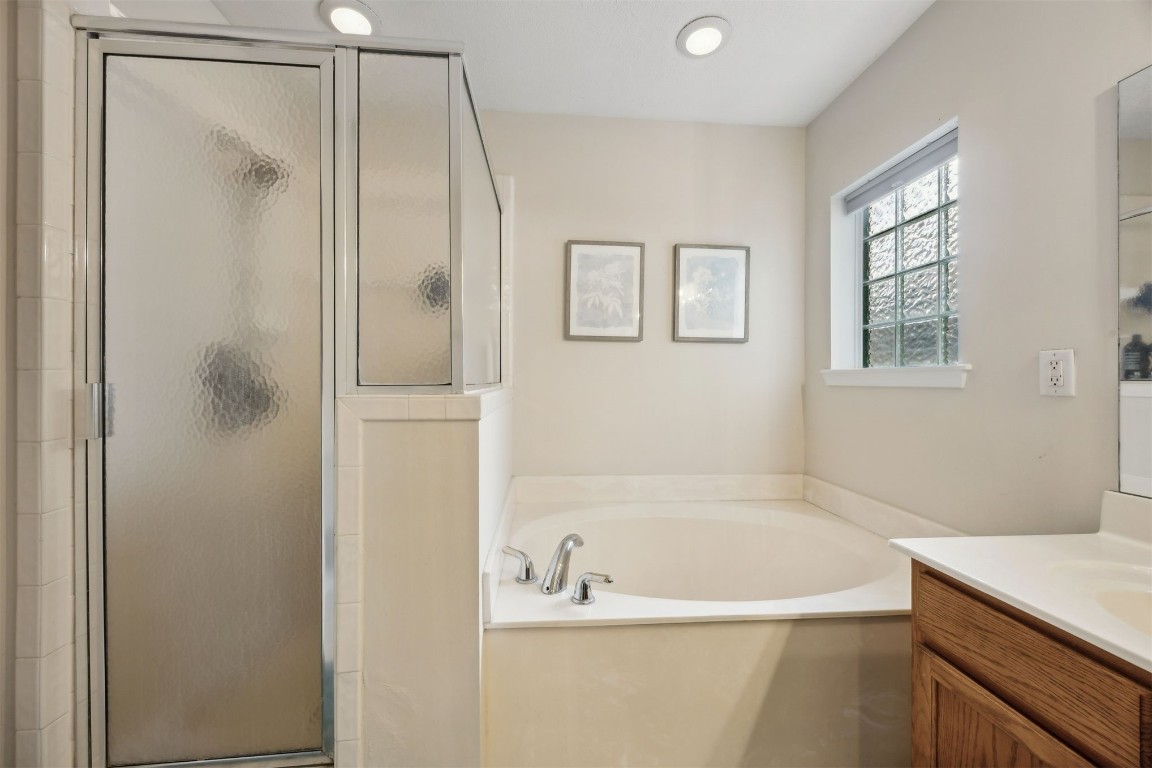 86132 Red Holly Place Yulee, FL 32097 - Photo 22 of 40 a bathroom with a tub and a shower