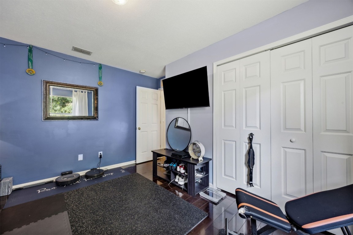 86132 Red Holly Place Yulee, FL 32097 - Photo 26 of 40 a living room with furniture and a flat screen tv