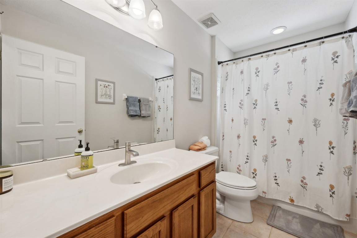 86132 Red Holly Place Yulee, FL 32097 - Photo 27 of 40 a bathroom with a sink toilet and shower