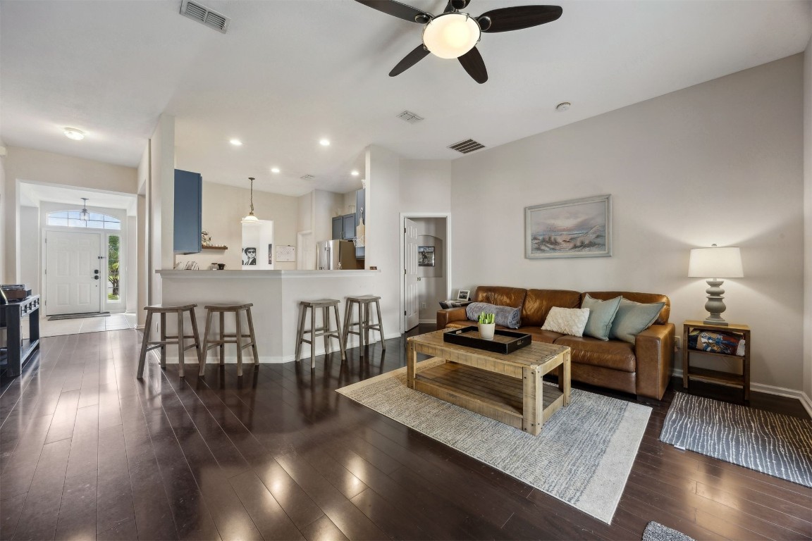 86132 Red Holly Place Yulee, FL 32097 - Photo 5 of 40 a living room with furniture and a wooden floor