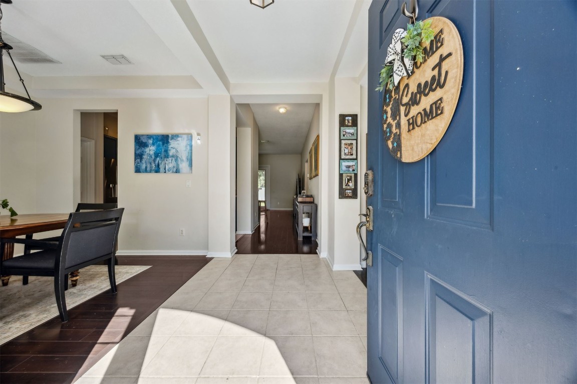 86132 Red Holly Place Yulee, FL 32097 - Photo 6 of 40 a bedroom with a bed and a table in it