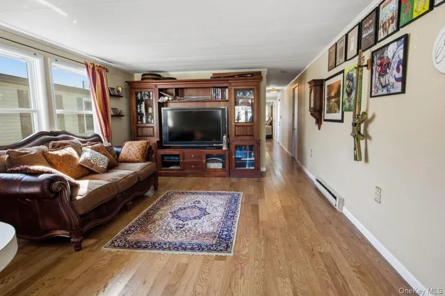 a room with pool table and windows