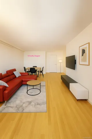 a spacious bedroom with a bed and a flat screen tv