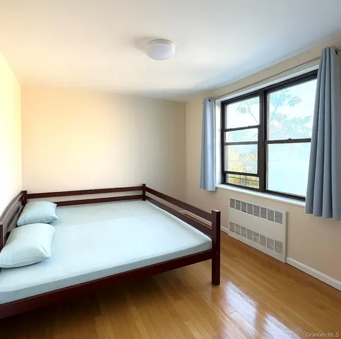 a room with a bed and a window