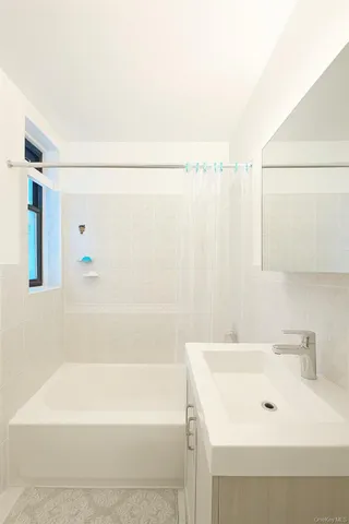 a bathroom with a white bath tub