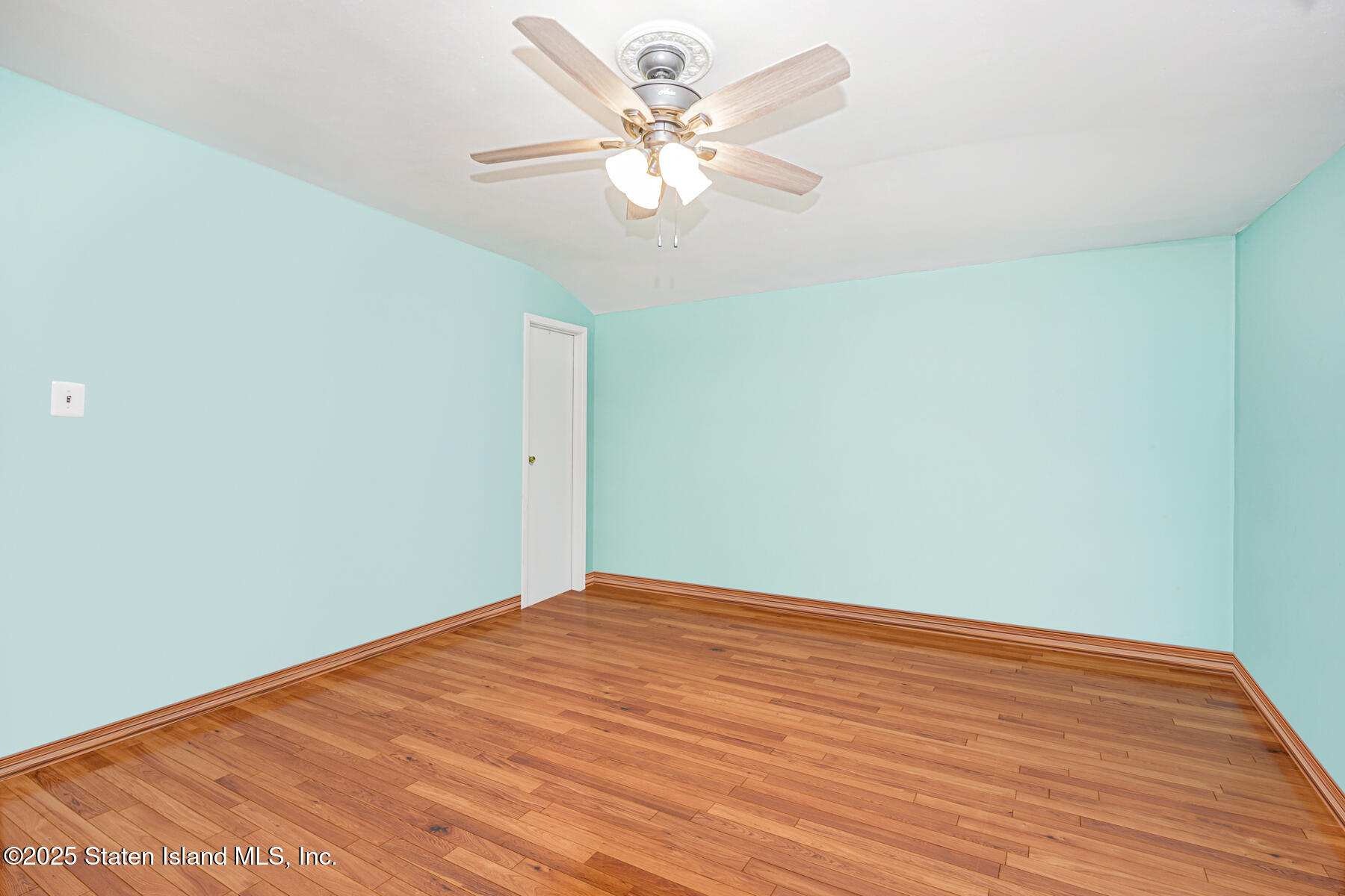 33 Ebey Lane Staten Island, NY 10312 - Photo 15 of 23 a view of an empty room with a chandelier fan