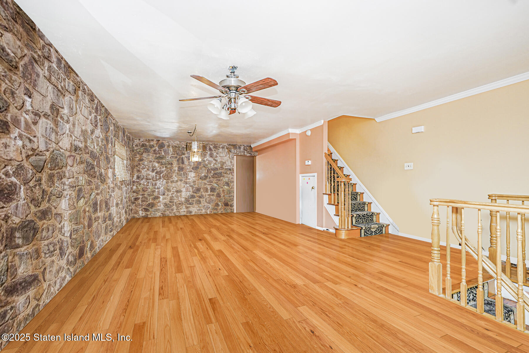 33 Ebey Lane Staten Island, NY 10312 - Photo 2 of 23 a view of empty room with wooden floor