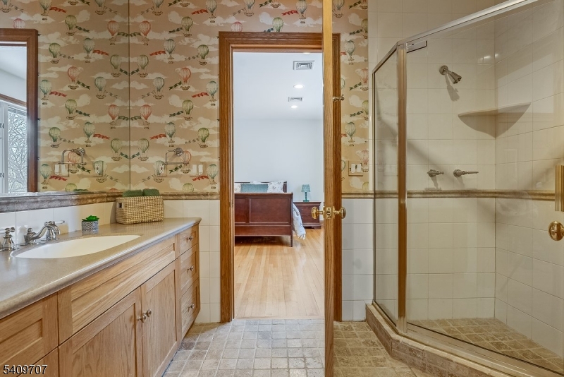 120 Goodale Road Newton, NJ 07860 - Photo 23 of 47 a en suite bathroom with a sink a mirror and shower