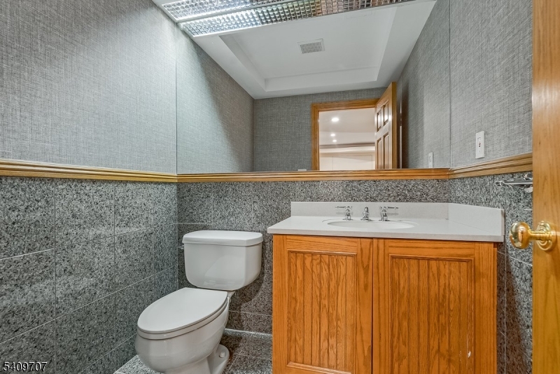 120 Goodale Road Newton, NJ 07860 - Photo 47 of 47 a bathroom with a granite countertop sink and a toilet