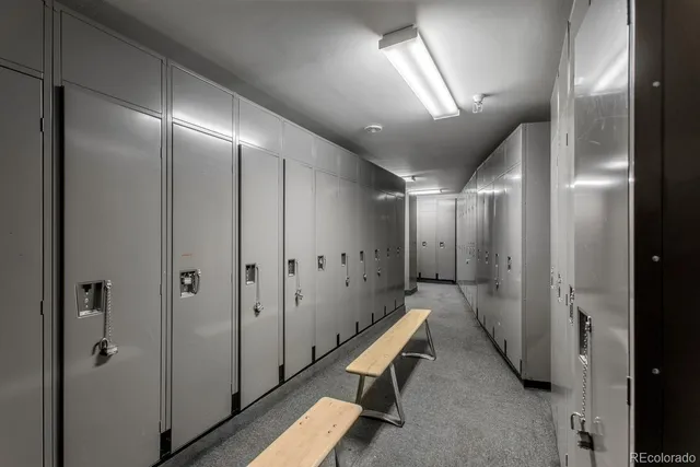 a very nice looking hallway with a large mirror