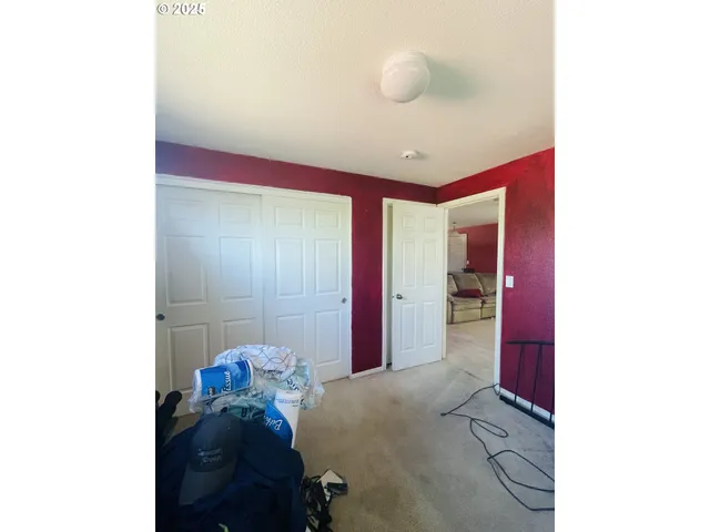 a living room with furniture and a gym