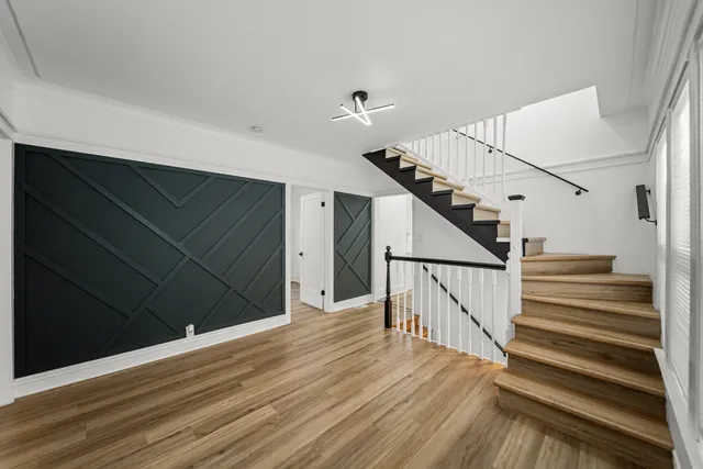a large kitchen with a lot of counter space and stainless steel appliances