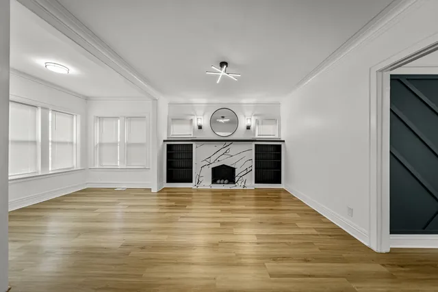 a kitchen with white cabinets and sink