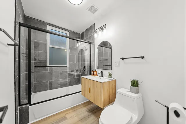 a view of room with window and wooden floor
