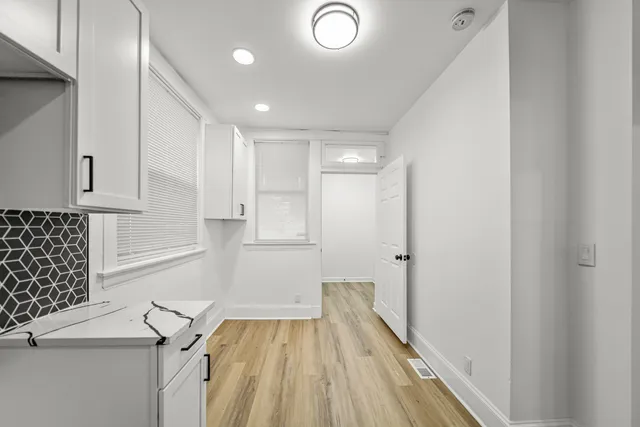 a view of entryway with wooden floor