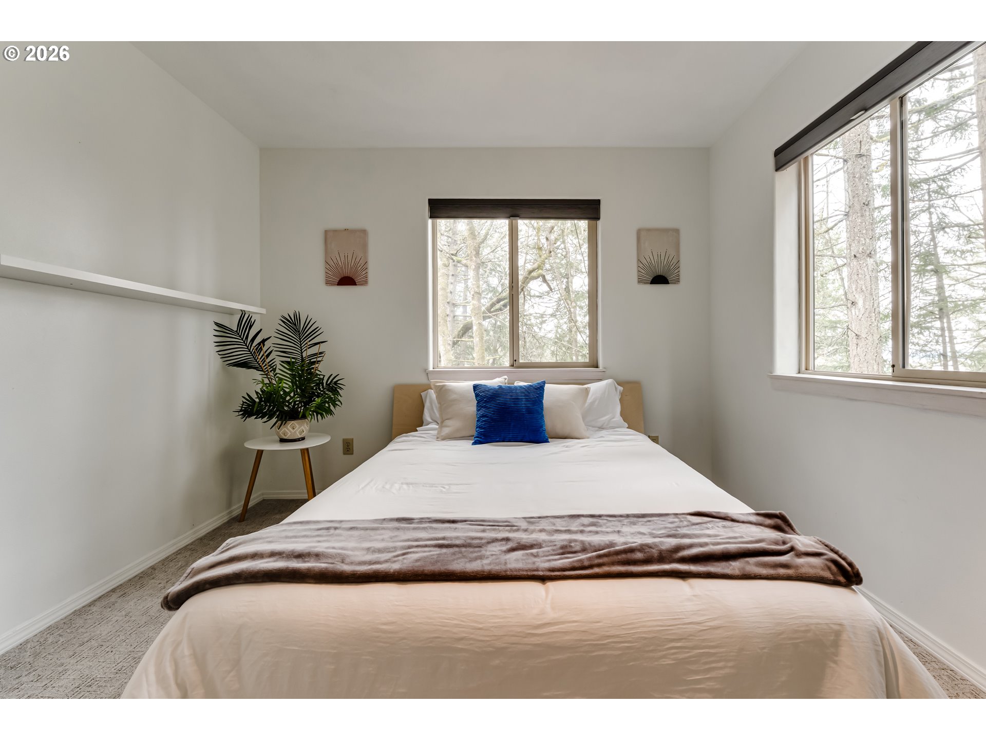2736 Kismet Way Eugene, OR 97405 - Photo 30 of 48 a bedroom with a bed and a potted plant