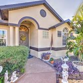 a front view of a house with garden