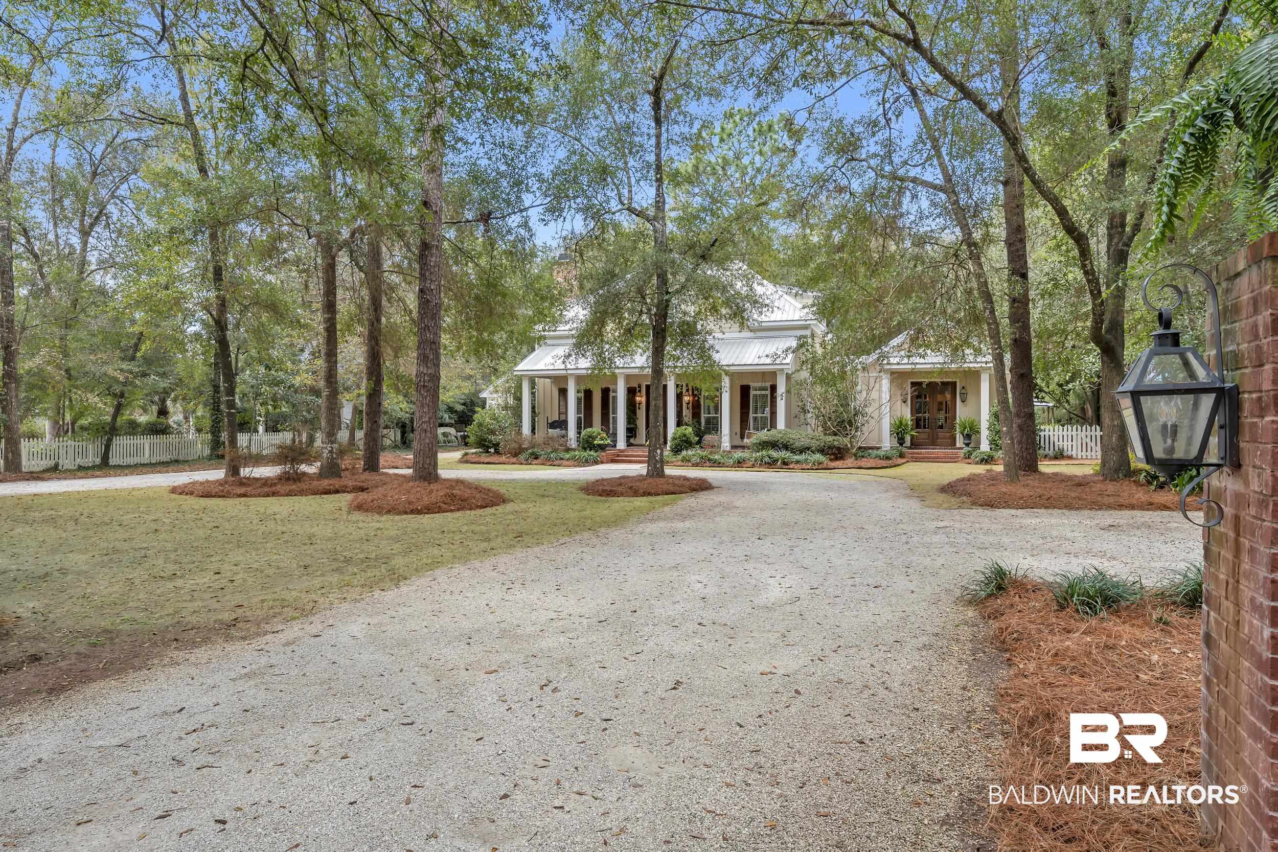 12161 Jessamine Street Magnolia Springs, AL 36555 - Photo 60 of 70 Neoclassical home with covered porch, curved driveway, and a standing seam roof
