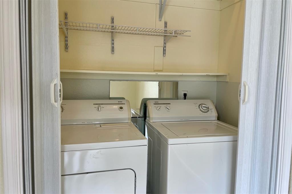 4748 Old Bent Tree Lane, Unit 1404 Dallas, TX 75287 - Photo 16 of 25 a utility room with dryer and washer