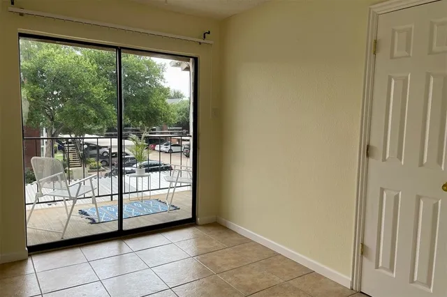 a view of a room with sliding glass door